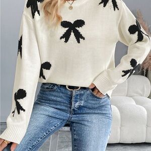 Chic White Sweater with Black Bow Accents